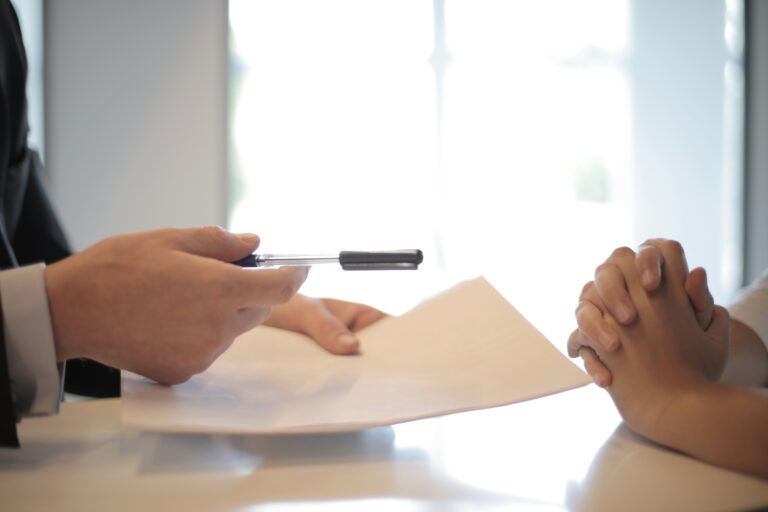 crop-businessman-giving-contract-to-woman-to-sign-3760067